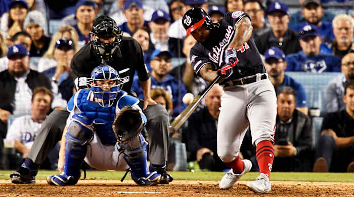 Oct 9, 2019; Los Angeles, CA, USA; Washington Nationals second baseman Howie Kendrick (47) hits a grand slam during the 10th inning in game five of the 2019 NLDS playoff baseball series against the Los Angeles Dodgers at Dodger Stadium. Mandatory Credit: Robert Hanashiro-USA TODAY Sports